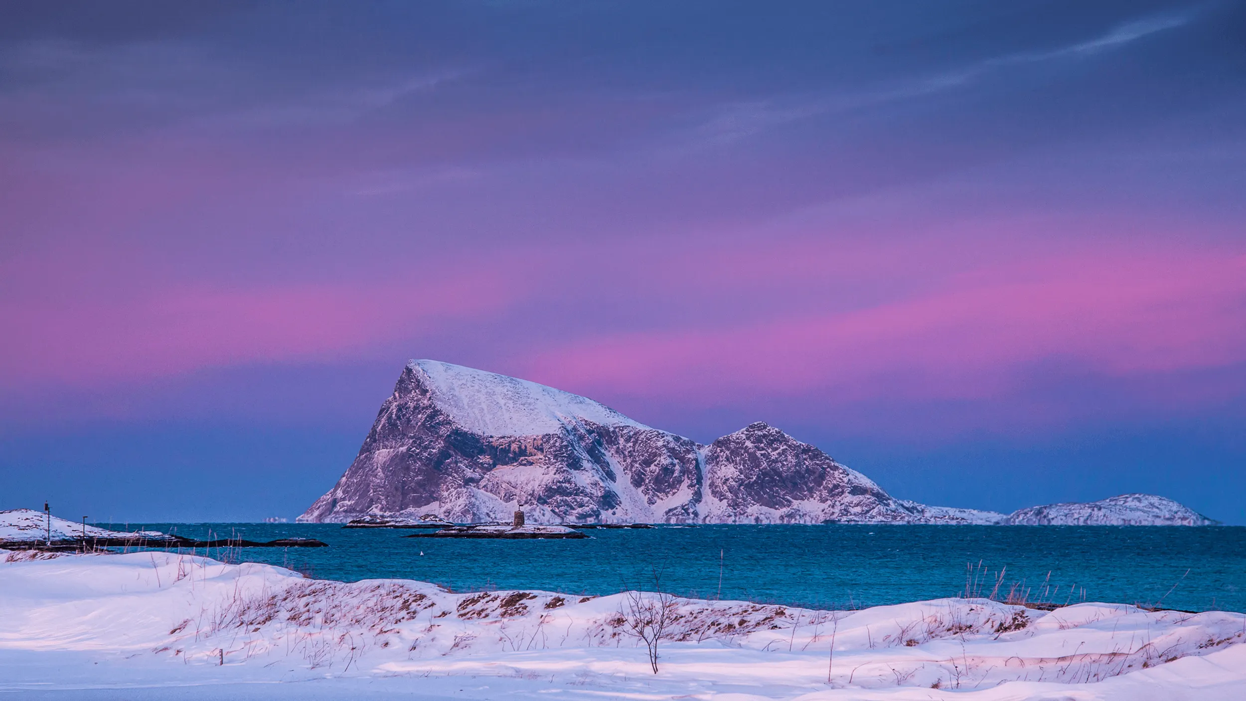 Northern lights over a Tromsø fjord